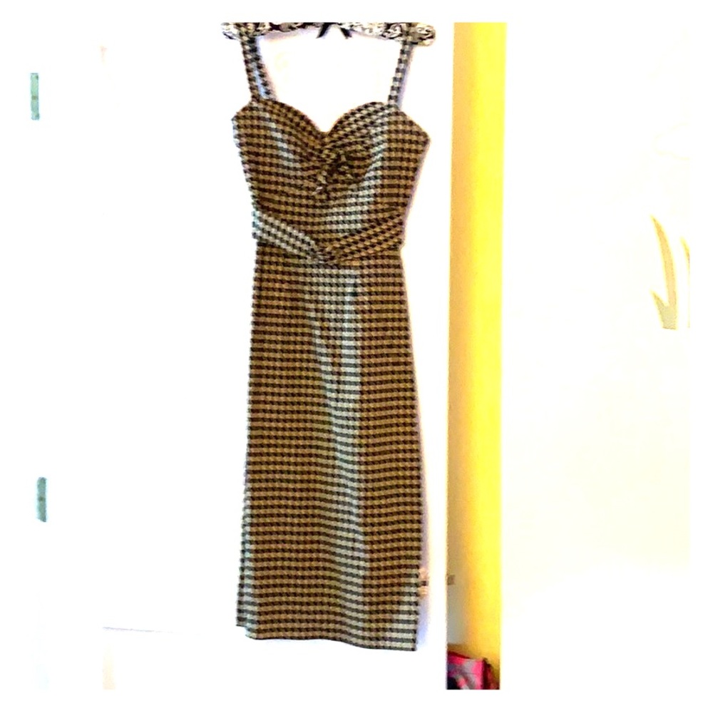 Form fitting black and gold dress
